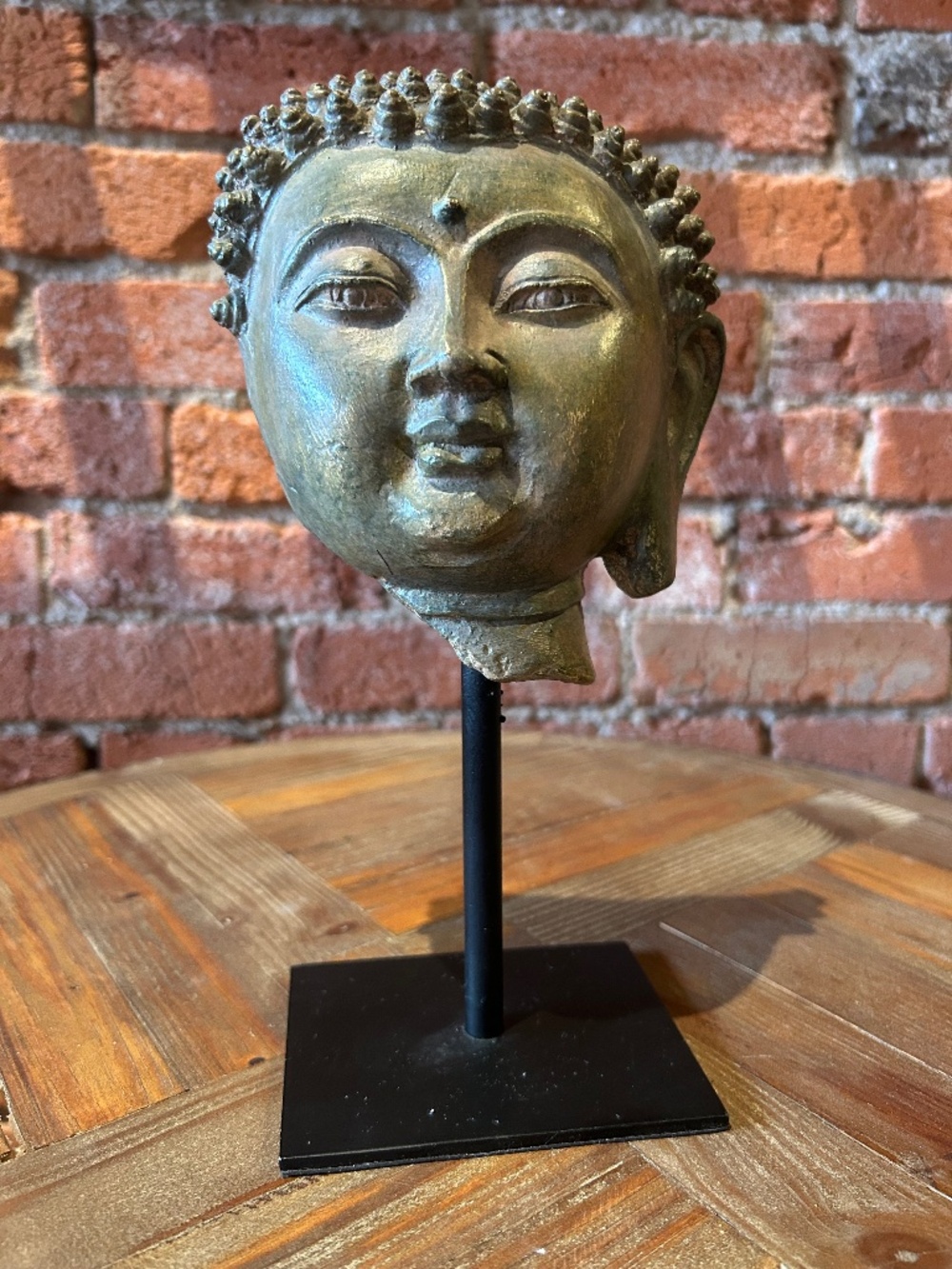 Cyan Buddha on metal stand